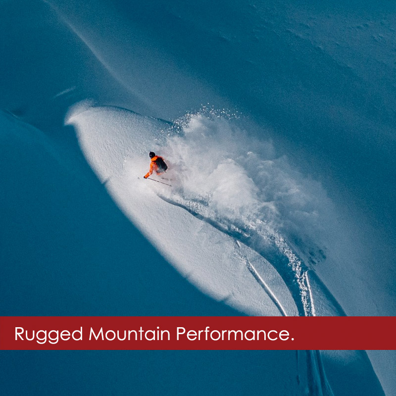 Man big mountain skiing in a Stio ski jacket