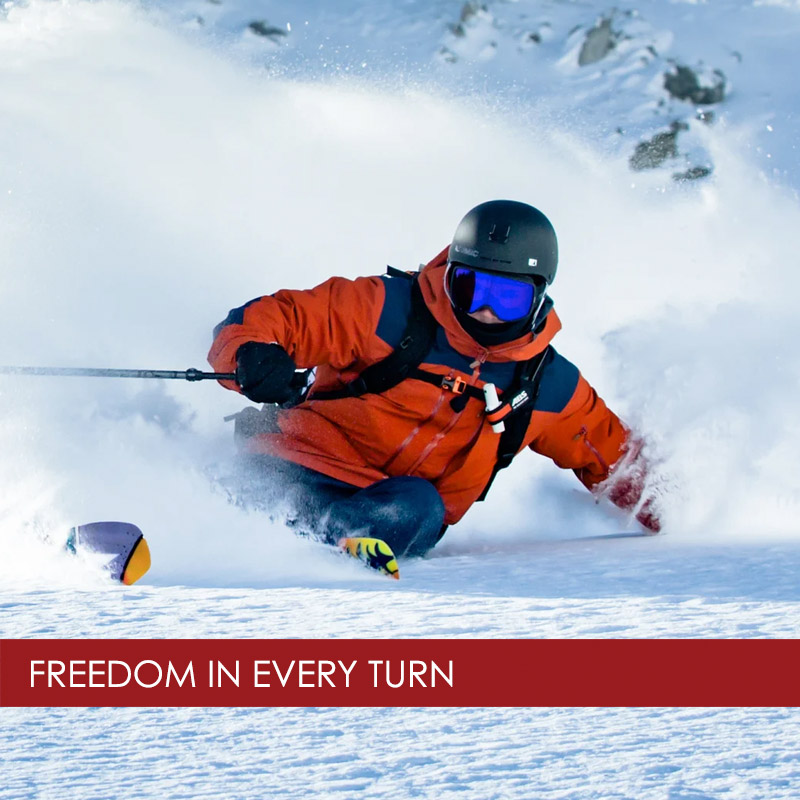 man skiing powder in a Norrona ski jacket
